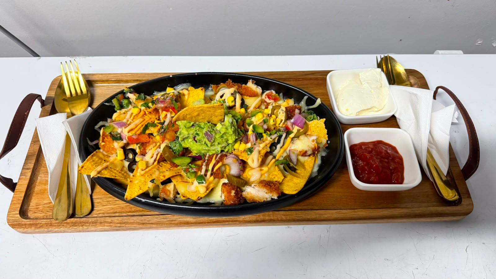 Loaded chicken nachos with guacamole at Illumina
